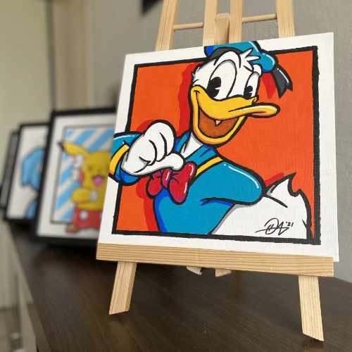 Donald Duck pointing at himself with an orange background